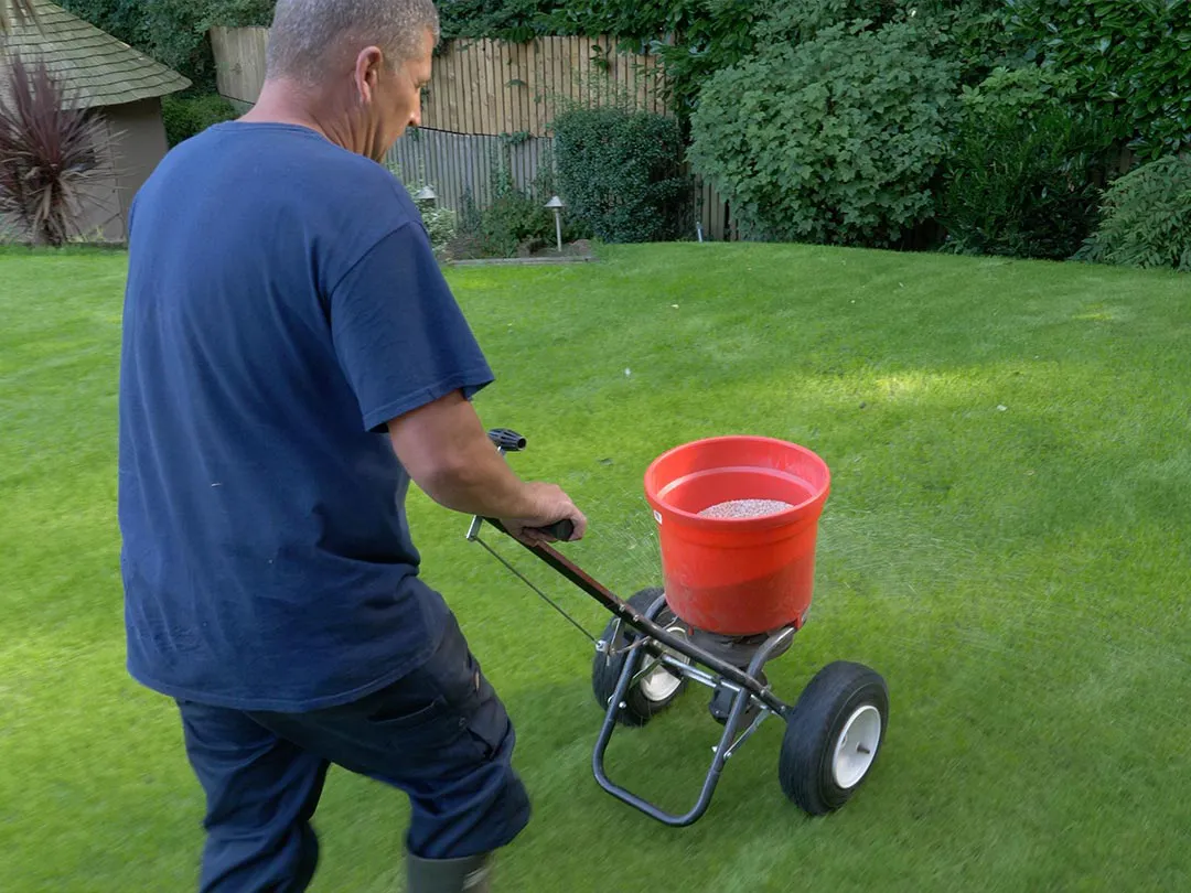 Greenkeeper seeding grass.webp